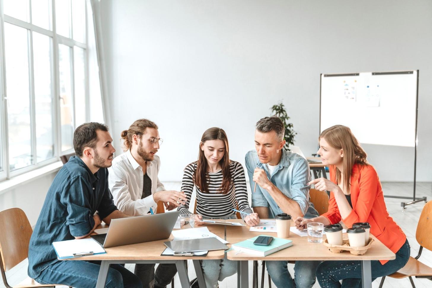Business professionals analyzing marketing data and strategy documents